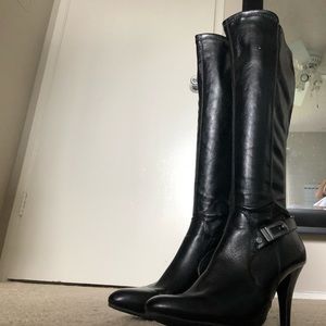 Brand new.  Never worn high heeled boot.